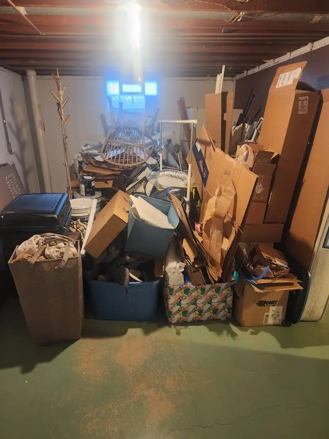 Roll-off dumpster container at job site for 2 Yard Dumpster Rental in Natick